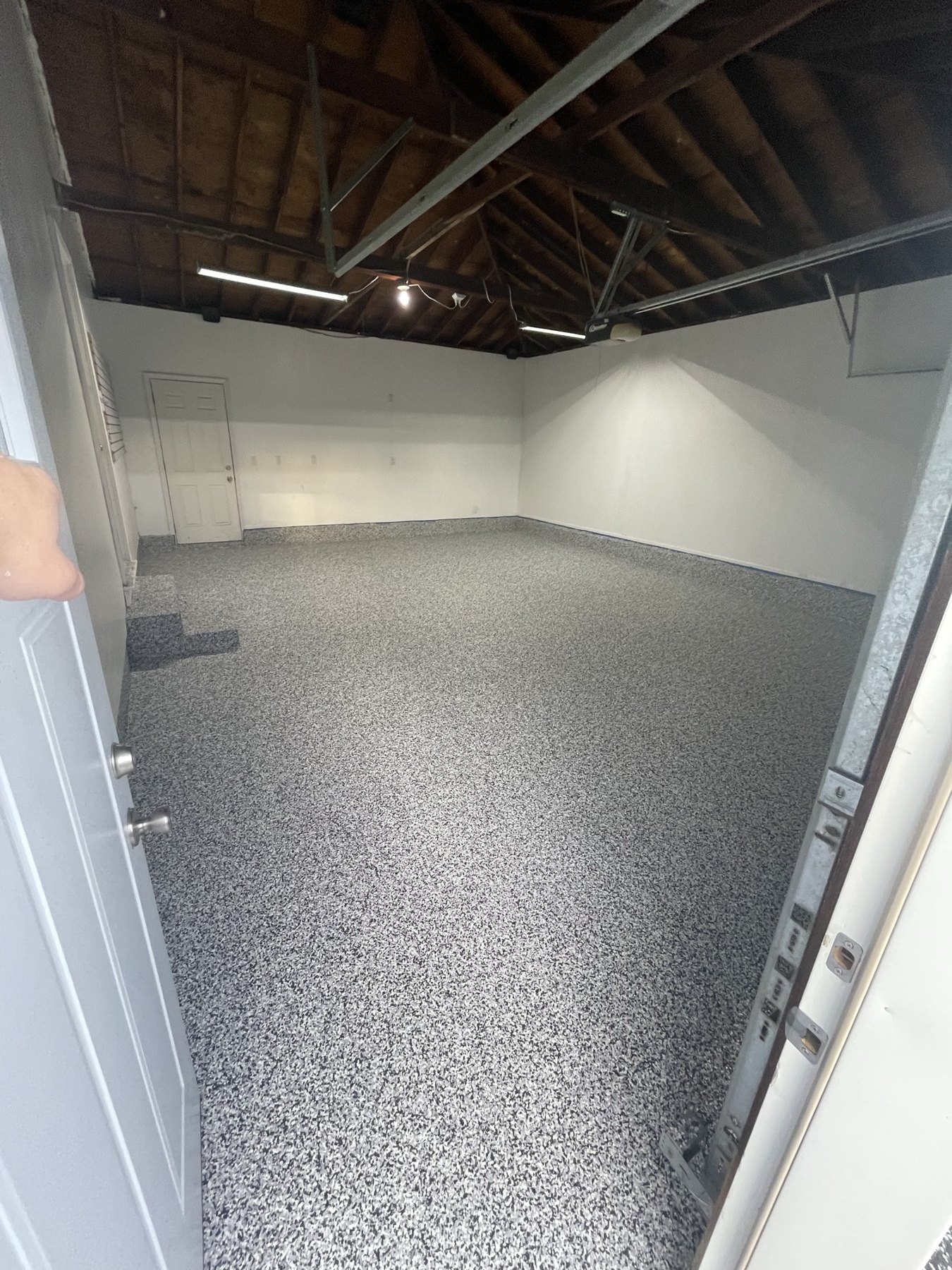 Large open interior space finished with gray flake epoxy floor coating